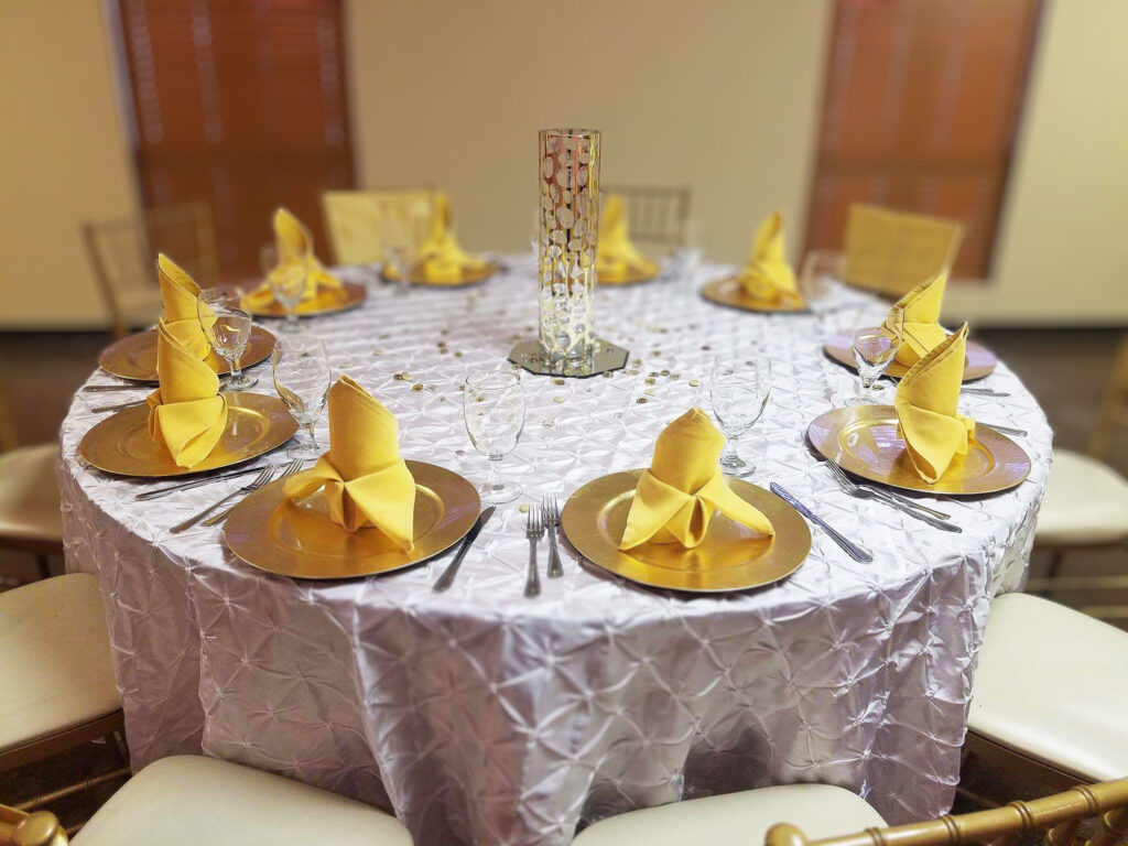 Beautiful table decoration, white and gold with textured cloth